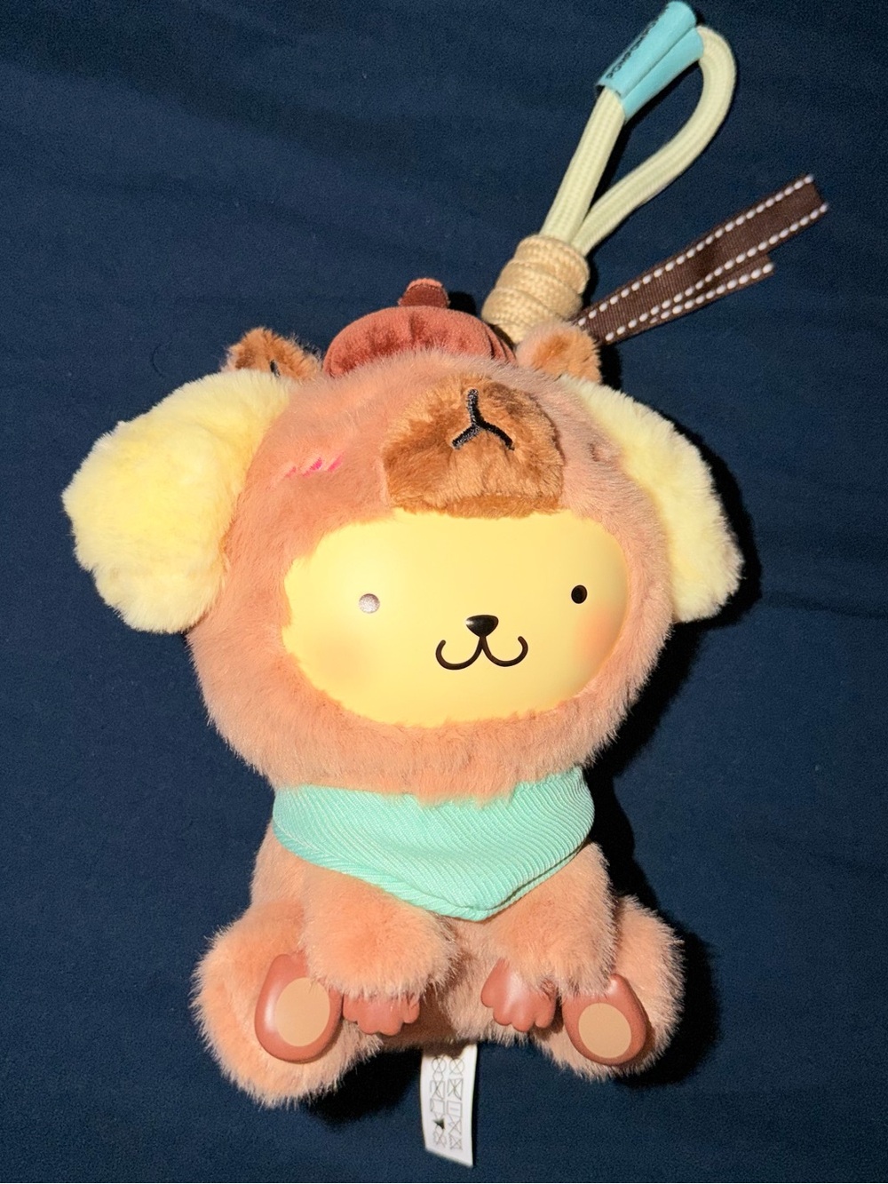 MINISO - Capybara Pompompurin Plush Keychain
